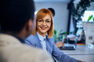 Businesswoman with braces at her work