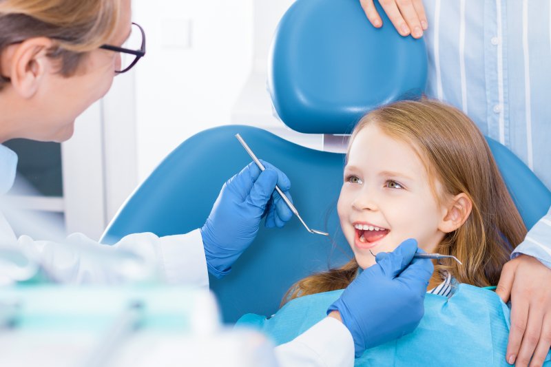 Child smiles at orthodontist